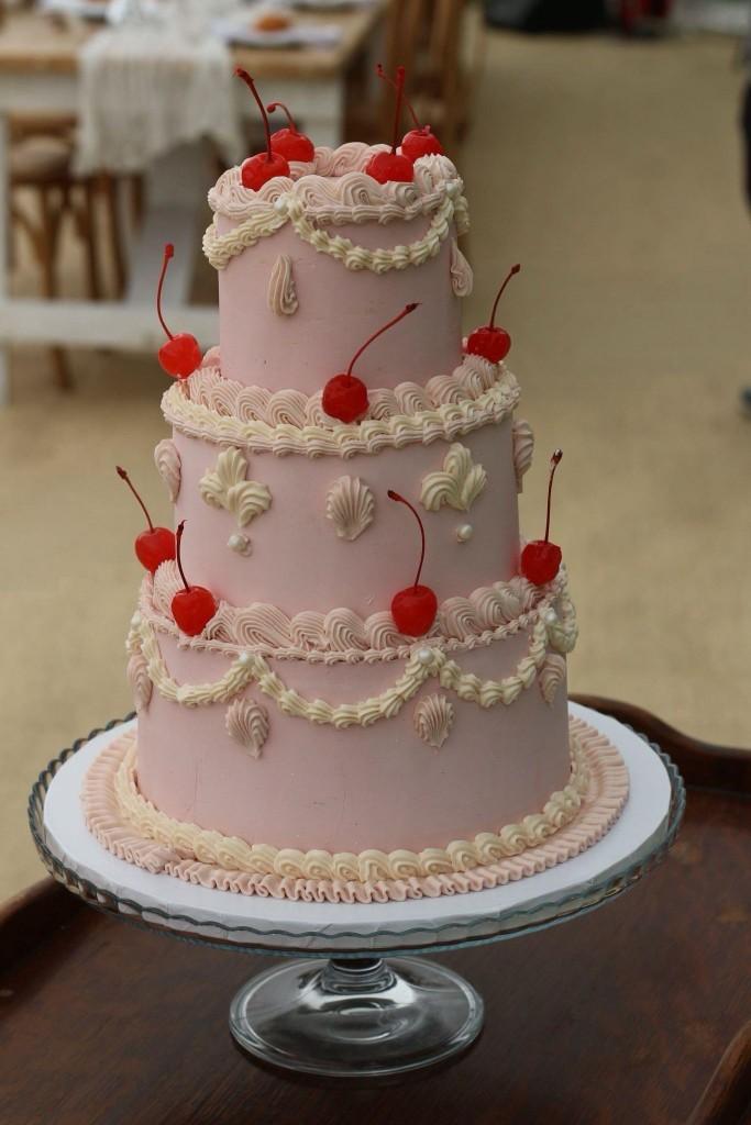 Tiered wedding cake with fresh floral styling