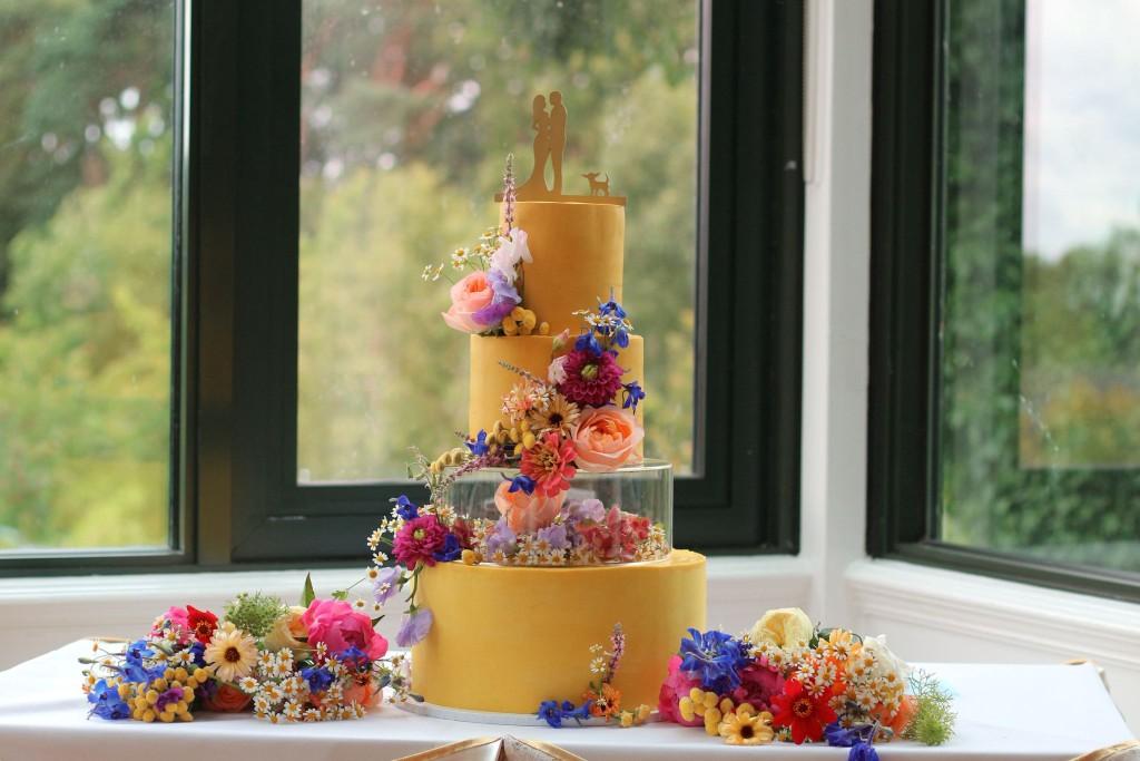 Garden wedding cake with monogram topper