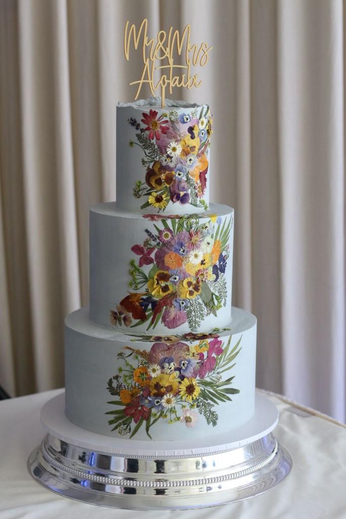 Multi-tier wedding cake with fresh flowers