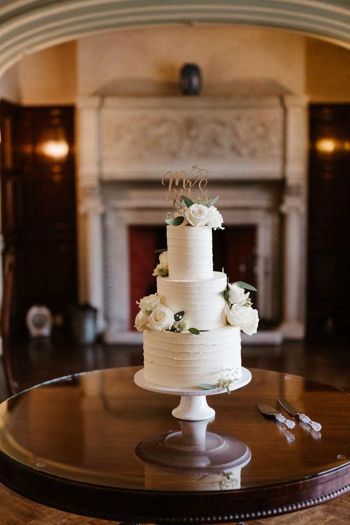 Classic vintage-style wedding cake with piped swags and cherries