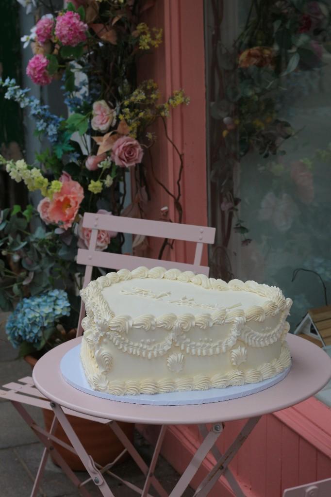 Bespoke wedding cake with seasonal flowers